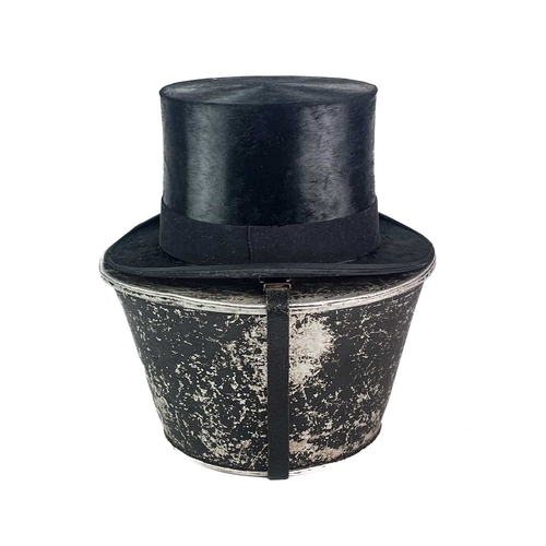 284 - A Dunn & Co top hat in a painted tin box. Size 15, stamped 'Natural Tanned Calf', height of the box ... 