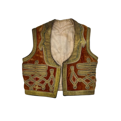 285 - An Afghan waistcoat circa 1960s Together with an Islamic textile and two other textiles. (4)