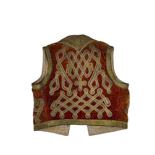 285 - An Afghan waistcoat circa 1960s Together with an Islamic textile and two other textiles. (4)