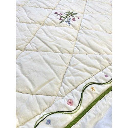 286 - A handsewn and embroidered single quilt with valance. White linen with hand embroidered flowers, wid... 