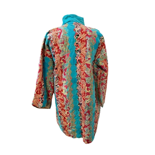 288 - A hand-sewn reversible patchwork coat. With hexagonal patchwork pieces, brightly coloured fabrics to... 