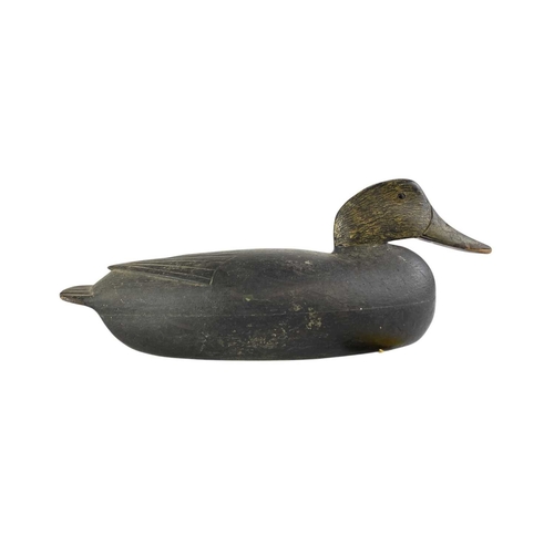 296 - An American black painted hollow duck decoy. Early 20th century, the lead weight with a copper plaqu... 