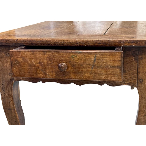 297 - A French provincial fruitwood farmhouse kitchen table. Mid 19th century, with one end drawer opposed... 