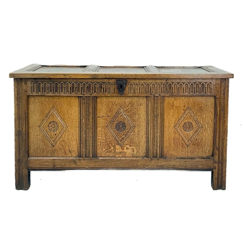 298 - A panel oak coffer. 18th century, with an arcaded frieze above three lozenge carved panels, height 6... 