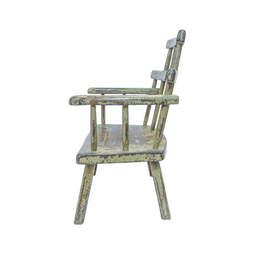 299 - A primitive painted Welsh style stick back Windsor chair. With a stepped top rail, outswept arms, on... 