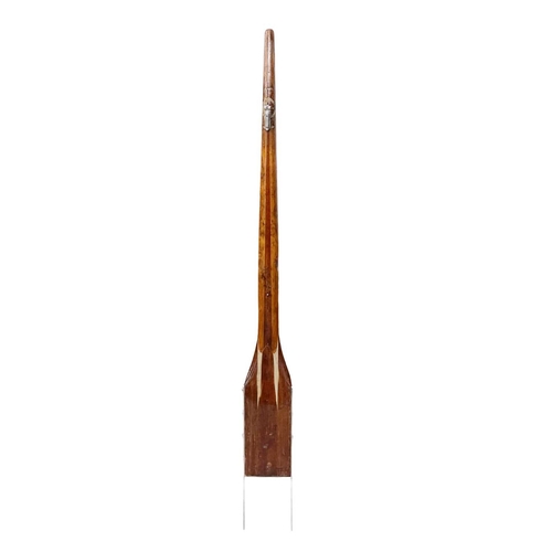 30 - A laminated ash and mahogany yacht tiller. With a stainless steel yoke, length 164cm.