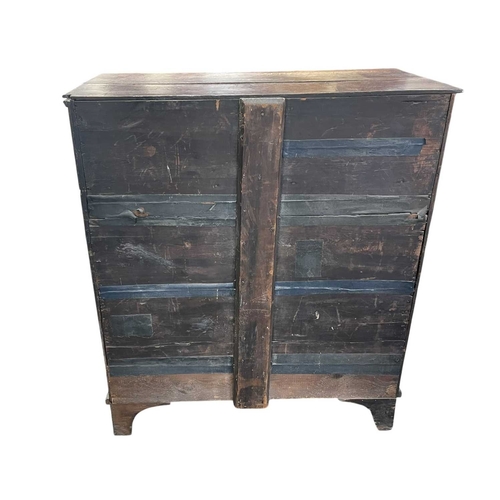 311 - A George III oak and crossbanded chest. Fitted two short and three long drawers, on bracket feet, he... 