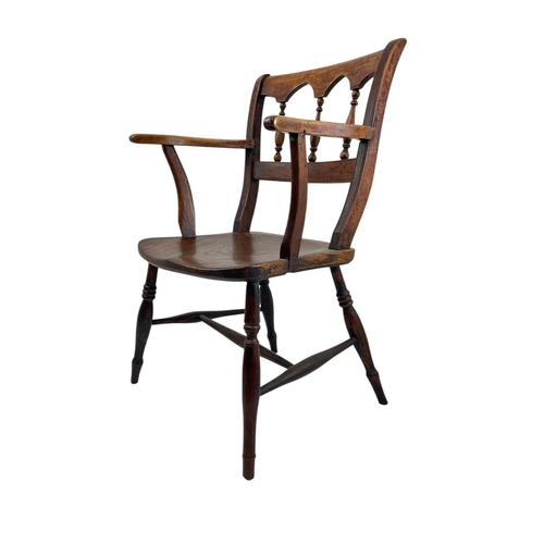 312 - A fruitwood and elm Windsor armchair. Circa 1860, with an arcaded spindle back, on turned legs, heig... 