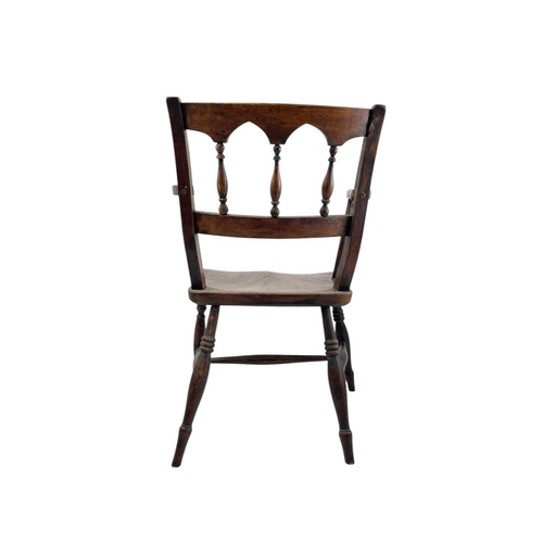 312 - A fruitwood and elm Windsor armchair. Circa 1860, with an arcaded spindle back, on turned legs, heig... 