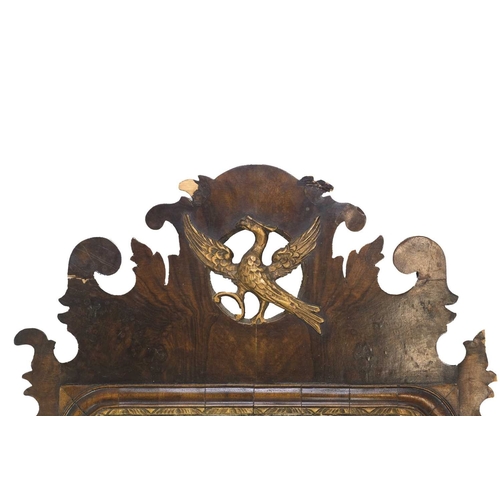 314 - A George I style walnut fretwork wall mirror. Circa 1900, with a gilt disheveled bird crest, the rec... 