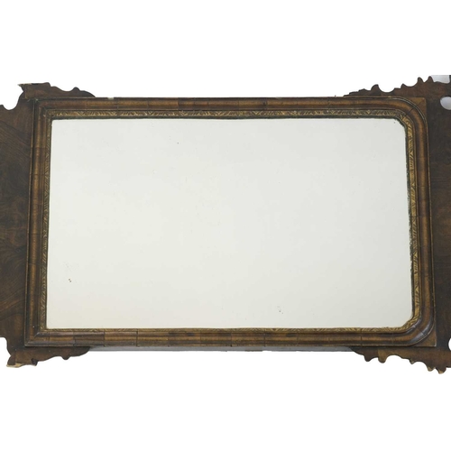 314 - A George I style walnut fretwork wall mirror. Circa 1900, with a gilt disheveled bird crest, the rec... 