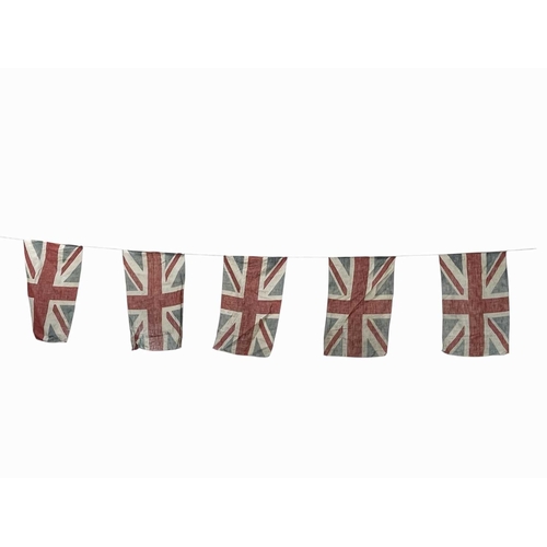 317 - A string of 20th century linen union jack bunting Each flag measuring 40cm x 21cm, with a freestandi... 