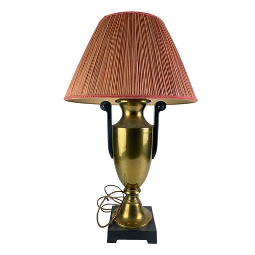 318 - A pair of brass urn table lamps. On raised black square bases, with black scrolling handles, height ... 