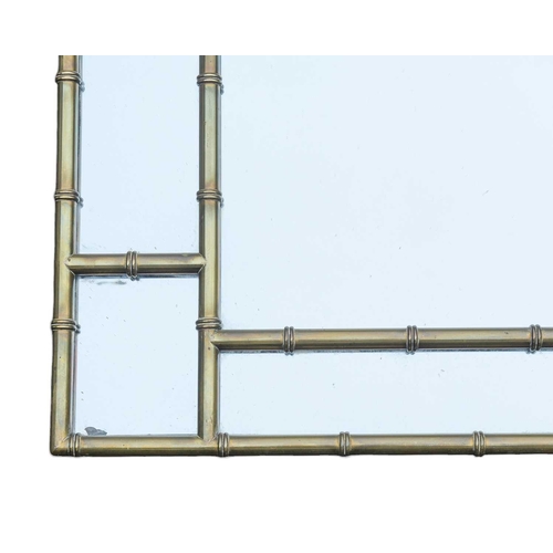 319 - A mid century simulated bamboo brass framed wall mirror. In the chinoiserie taste, 123X86.5cm.