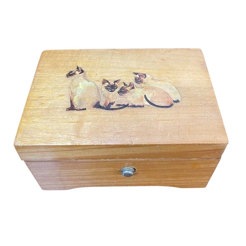 32 - Two Thorens music boxes. One carved oak and the other decorated with Siamese cats, both require atte... 