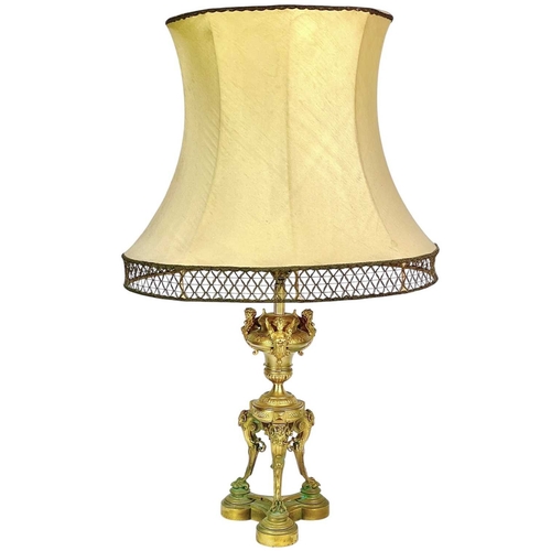 320 - A pair of French Napoleon III ormolu table lamps. Each with an urn support mounted with three winged... 