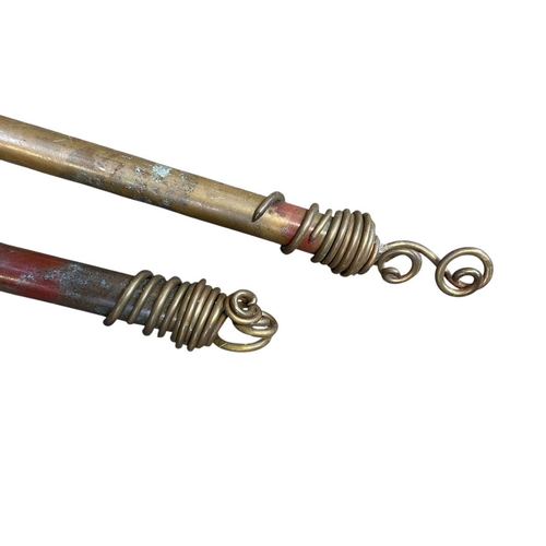 323 - Tracey Adam Metalworks, Two bespoke curtain poles. With a patinated finish and twist ends. Widths169... 