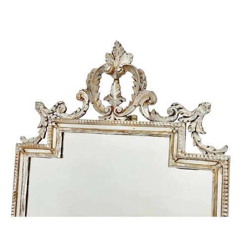 324 - A carved giltwood wall mirror. Late 19th century, with a stepped rectangular plate, leaf and scroll ... 