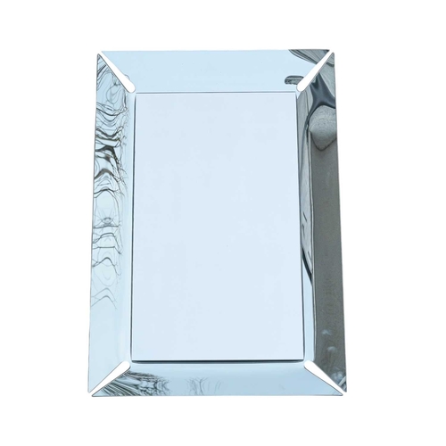 327 - A contemporary Italian Calligaris Pleasure Mirror. With a curved, raised edge, 100X67cm.