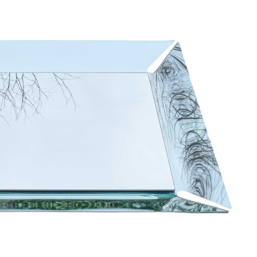 327 - A contemporary Italian Calligaris Pleasure Mirror. With a curved, raised edge, 100X67cm.