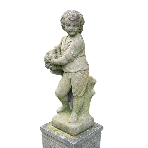 350 - A reconstituted stone statue of a boy with a basket of fruit. On a reconstituted stone stand with wr... 