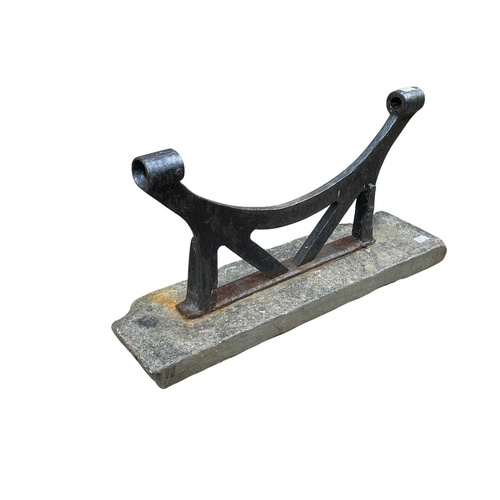 355 - A large roller brush foot scraper. Formed of cast iron on a rustic slate base, height 30cm, width 60... 