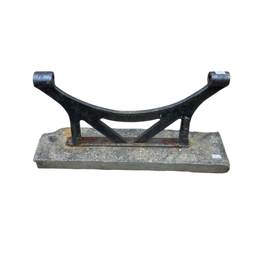 355 - A large roller brush foot scraper. Formed of cast iron on a rustic slate base, height 30cm, width 60... 