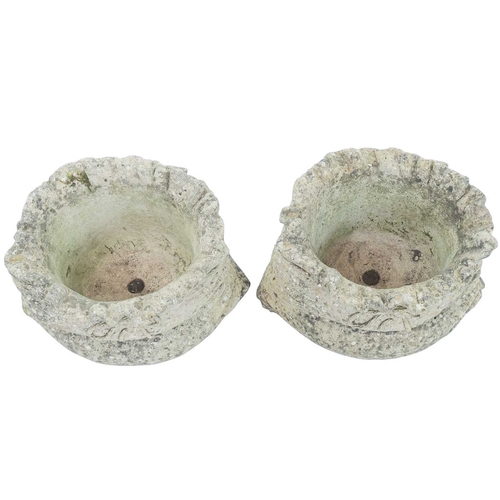 358 - A pair of weathered reconstituted stone garden planters. Cast as ribbon tied sacks, height 21cm (2).