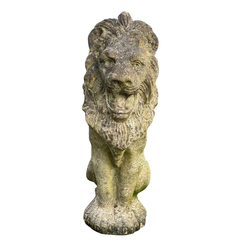 361 - A pair of reconstituted stone lions. Seated, height 48cm.