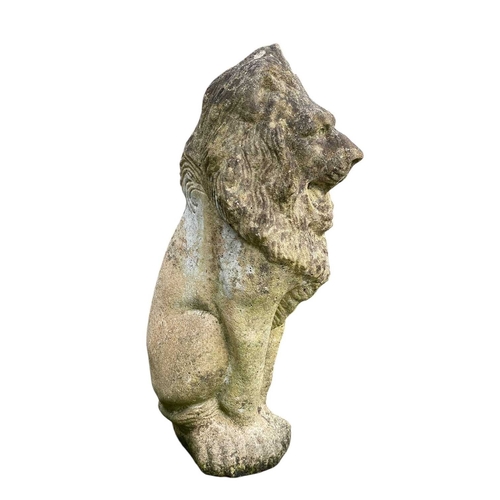 361 - A pair of reconstituted stone lions. Seated, height 48cm.