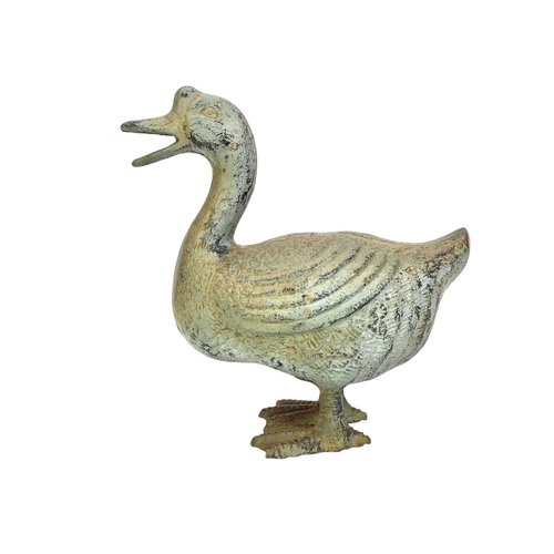 363 - A cast metal Chinese goose. Overpainted in a rustic green, height 25cm and width 23cm.