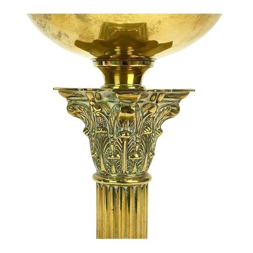 37 - A late Victorian brass oil lamp. With a clear etched glass shade, on a Corinthian column support, ov... 