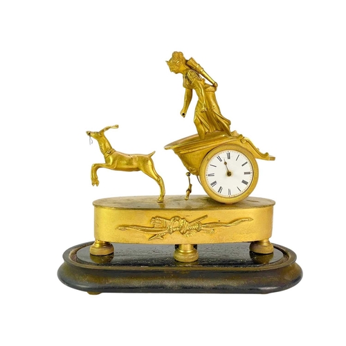 371 - A Regency gilt metal timepiece. Cast as Diana in her stag driven chariot, the watch type movement si... 