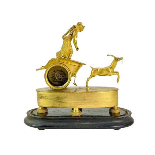 371 - A Regency gilt metal timepiece. Cast as Diana in her stag driven chariot, the watch type movement si... 