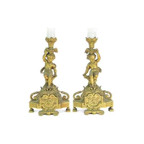 376 - A French ormolu clock garniture. Circa 1880, with a circular white enamel dial, the drum case flanke... 