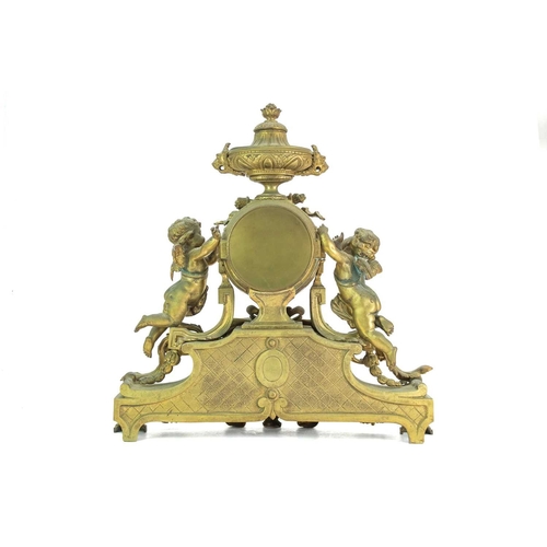 376 - A French ormolu clock garniture. Circa 1880, with a circular white enamel dial, the drum case flanke... 