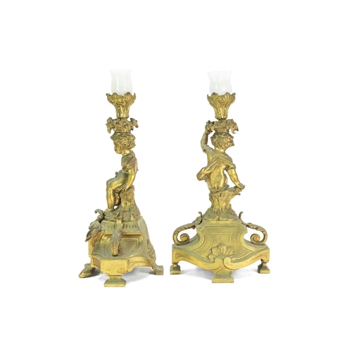 376 - A French ormolu clock garniture. Circa 1880, with a circular white enamel dial, the drum case flanke... 