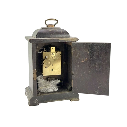 378 - A small continental pearwood cased timepiece. 19th century, With a brass face and forward facing vis... 