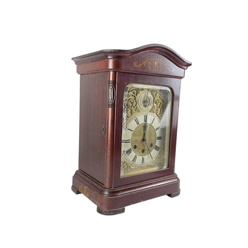 379 - A German mahogany cased triple train mantel clock. Circa 1900, the matt gilt dial with chime/silent ... 