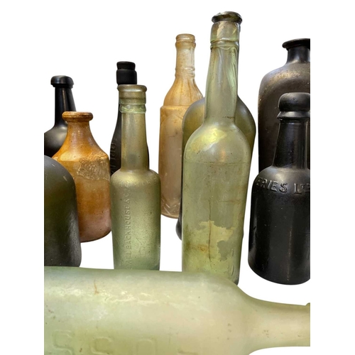 38 - 15 assorted glass bottles and two stoneware jars. Trawled, from around the UK, by a Newlyn based fis... 