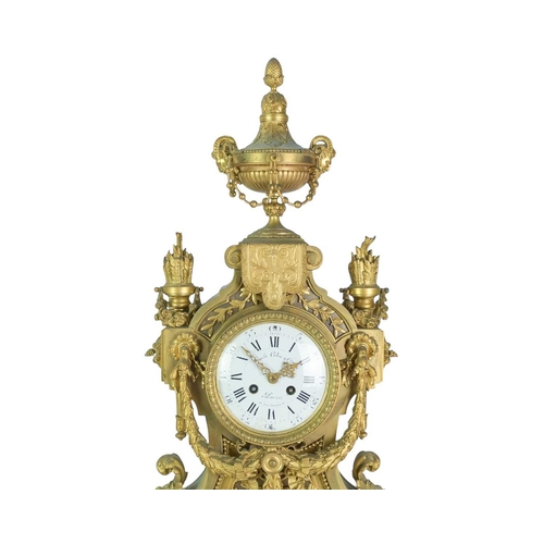 381 - An ornate French ormolu mantel clock. Circa 1870, the circular white dial signed 'Emile Colin & Cie,... 