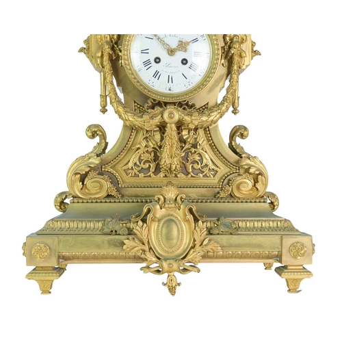 381 - An ornate French ormolu mantel clock. Circa 1870, the circular white dial signed 'Emile Colin & Cie,... 