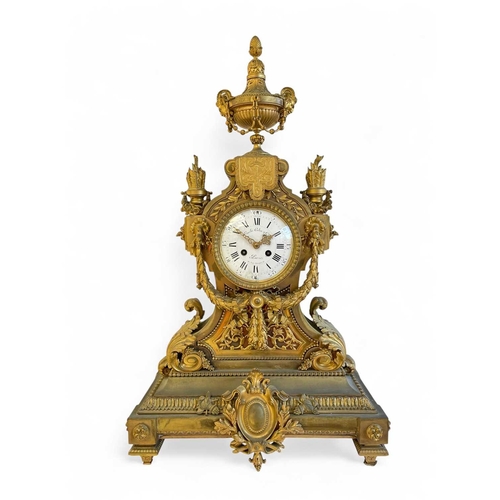 381 - An ornate French ormolu mantel clock. Circa 1870, the circular white dial signed 'Emile Colin & Cie,... 