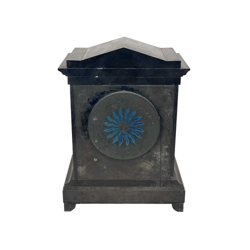 383 - A Victorian Aesthetic Movement black slate mantle clock. With twin column supports and cast metal fe... 