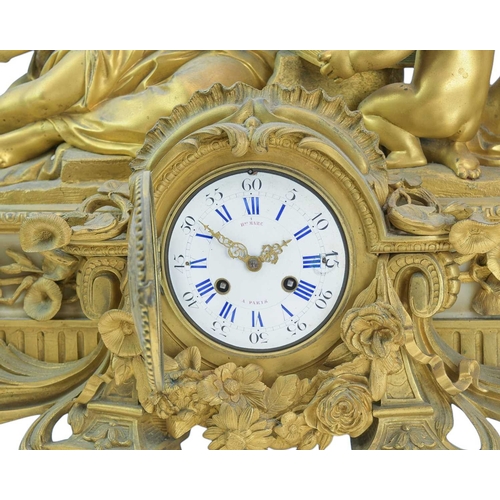 391 - An ornate French 19th century ormolu mantel clock by Henry Marc, Paris. The circular enamel dial wit... 