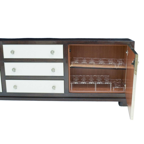 396 - ± Superyacht furnishings, a contemporary laquered drinks cabinet with chrome details. Featuring a hi... 