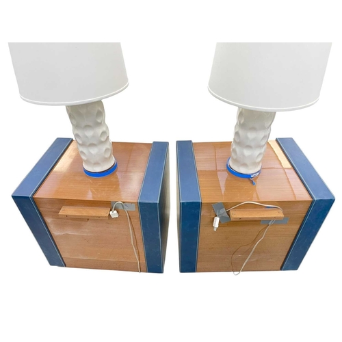 397 - ± Superyacht furnishings, a pair of highly laquered veneer bedside tables with integrated lamps. Thi... 