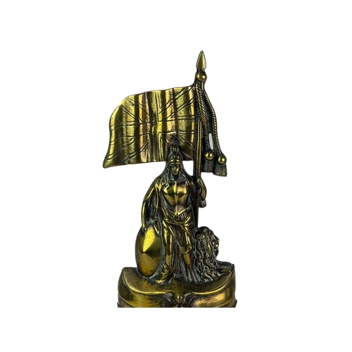 4 - A heavy Victorian brass door stop of Brittania. The figure cast in a typical pose upon the bow of a ... 