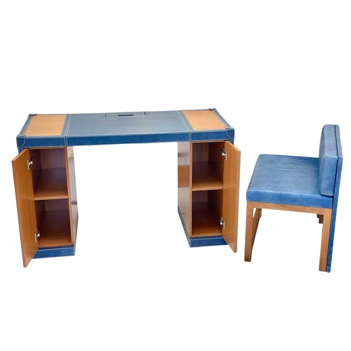 402 - ± Superyacht furnishings, a blue leather space-saving desk with a matching upholstered chair. A cont... 