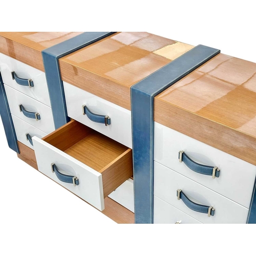 405 - ± Superyacht furnishings, a contemporary bank of nine drawers. With a highly laquered wood veneer ba... 